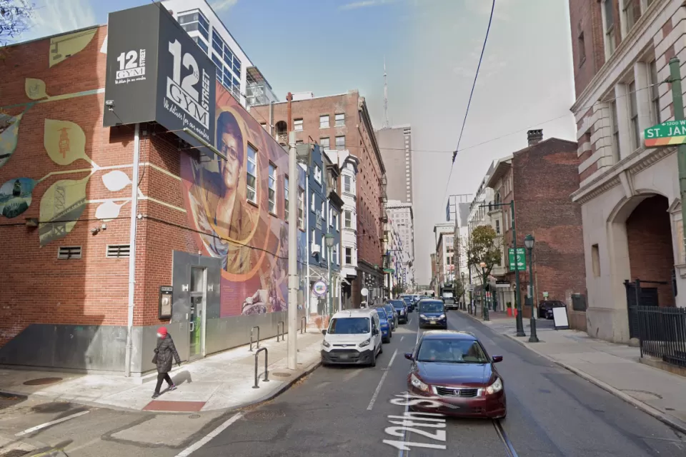 An image of a mural depicting Gloria Casarez on the outside of a gym on 12street in Philadelphia.